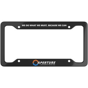 May include: Black plastic license plate frame with the text "WE DO WHAT WE MUST, BECAUSE WE CAN" and the Aperture Laboratories logo with the text "APERTURE LABORATORIES".
