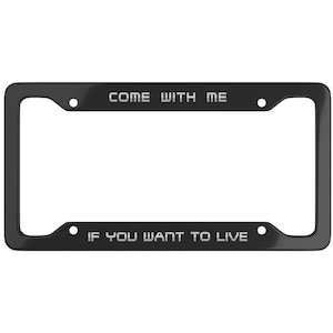 May include: Black license plate frame with the text "COME WITH ME" at the top and "IF YOU WANT TO LIVE" at the bottom. The text is in a white, sans-serif font.