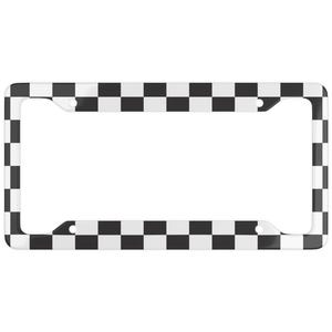 May include: A license plate frame with a black and white checkered pattern. The frame is rectangular with rounded corners and has four mounting holes. The checkered design covers the entire border of the frame.