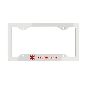 May include: A white rectangular license plate frame featuring a red six-pointed star of life symbol and the text TRAUMA TEAM printed in red block lettering on the bottom horizontal bar. The frame includes four circular mounting holes.