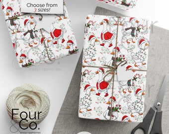May include: Christmas-themed wrapping paper featuring a pattern of geese wearing Santa hats and scarves, some with string lights and candy canes. The paper is wrapped around gifts and tied with twine. The text "Choose from 3 sizes!" is visible.
