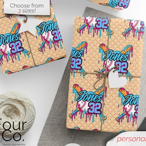 May include: Gift wrap featuring a baseball design with the name "Jones" and the number "32" in blue and pink. The background has a waffle-like texture. The text "Choose from 3 sizes!" is visible.