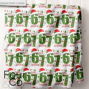 May include: White fabric with a repeating pattern of the numbers "6" and "7" in green, decorated with Christmas elements. Each number has a Santa hat. The words "six" and "seven" are also present. The text "choose from 3 sizes" is at the top.
