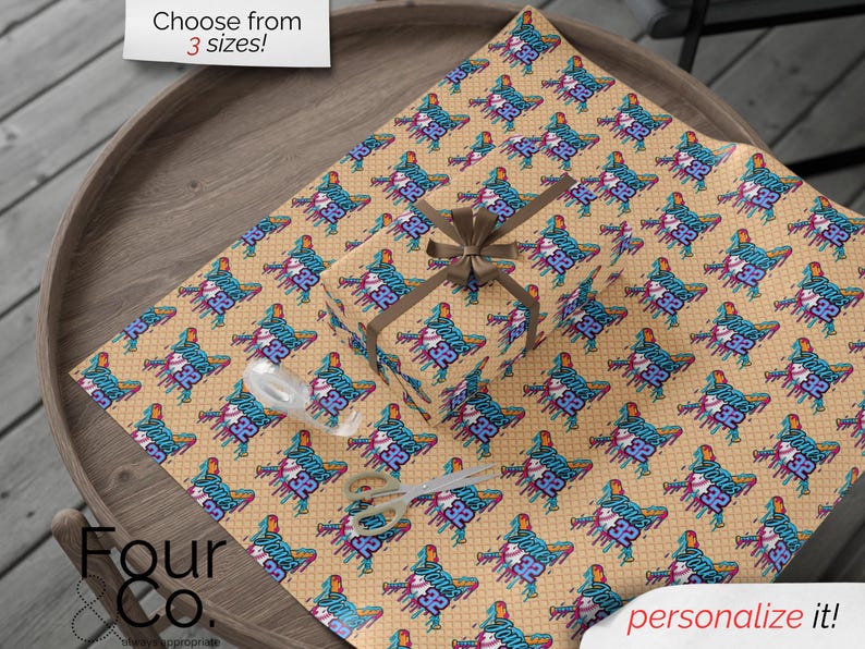 May include: Gift wrap featuring a repeating pattern of a stylized figure with the number "32" and the text "Jones". The wrapping paper is tan with a brown ribbon and bow. The text "Choose from 3 sizes!" is in the top left corner.