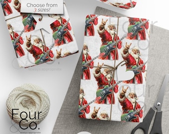 May include: Gift wrap featuring a repeating pattern of Santa Claus playing a green electric guitar and making a rock and roll hand gesture. The text "Choose from 3 sizes!" is visible. A spool of twine and scissors are also present.