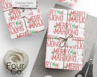May include: White wrapping paper with a red "MERRY MAHJO" pattern, tied with twine and a blank tag. The design includes green accents and Mahjong tile illustrations. The text "Choose from 3 sizes!" is visible.