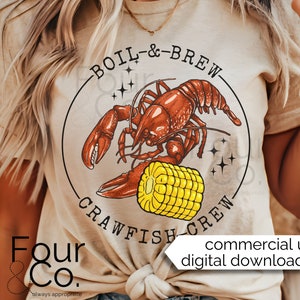 May include: A beige t-shirt with a graphic of a red crawfish and corn on the cob in a circle with the text "BOIL-&-BREW CRAWFISH CREW". The text "Four & Co. always appropriate" is at the bottom of the shirt.