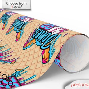 May include: Rolled paper with a repeating baseball-themed design. The design features a baseball with the text "GG Squad" in blue and pink, with orange and blue accents. The background is a light tan waffle pattern. Text at the top says "Choose from 3 sizes!"