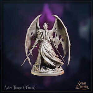 May include: A grey figurine of a winged character with a crown, holding two swords. The figure has torn clothing and wings with holes. The base has a swirling design. Text on the base reads "Ashen Tongue (35mm)" and "Great Grimoire".