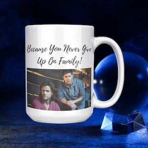 Supernatural-themed coffee mug inscribed with the quote, "Because You Never Give Up On Family!", Supernatural Fan Gift