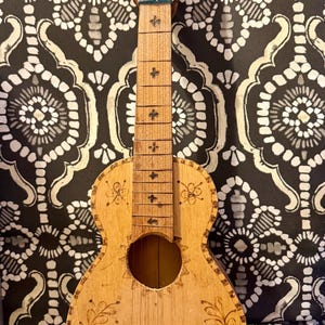 Vintage wood carved ukulele