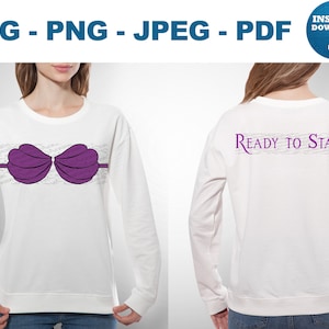 Op de afbeelding: Witte longsleeve sweatshirt met een paarse schelpen bh-design op de voorkant. De achterkant van de shirt heeft de tekst "Ready to Stand" in paars. Het ontwerp is een digitale download.