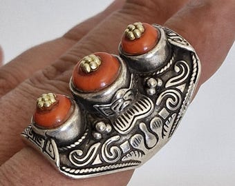 Vintage Chinese adjustable ring featuring a hand-carved dragon design and a natural coral stone.