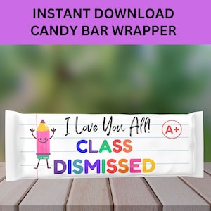 May include: A printable candy bar wrapper with a white background and a pencil character with a happy face. The text on the wrapper reads "I Love You All! Class Dismissed" with an A+ grade in a red circle. The wrapper has a lined paper design.