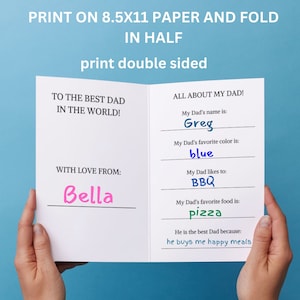 May include: A white, folded card with text that reads "TO THE BEST DAD IN THE WORLD!" and "ALL ABOUT MY DAD!" The card includes fill-in-the-blank sections for the dad's name, favorite color, likes, and favorite food. The card is printed on 8.5x11 paper.