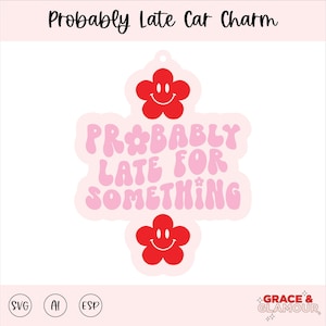 May include: A car charm with the text "Probably Late For Something" in pink and red. The charm has a flower shape with a smiling face at the top and bottom. The background is white.