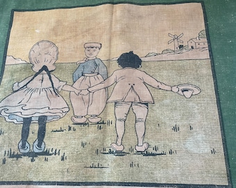 May include: Vintage linen textile featuring a pastoral scene with three children holding hands in a field. The illustration includes a windmill and a building in the background, with a green border.