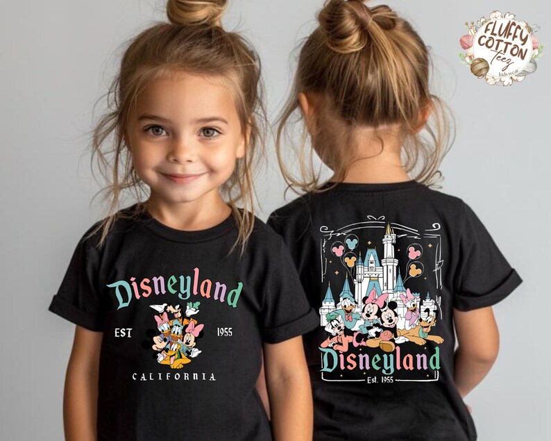 May include: Black t-shirts with Disneyland graphics. The front of the shirt features the Disneyland logo with Mickey Mouse and friends. The back of the shirt has a castle graphic with Disney characters. Est. 1955.