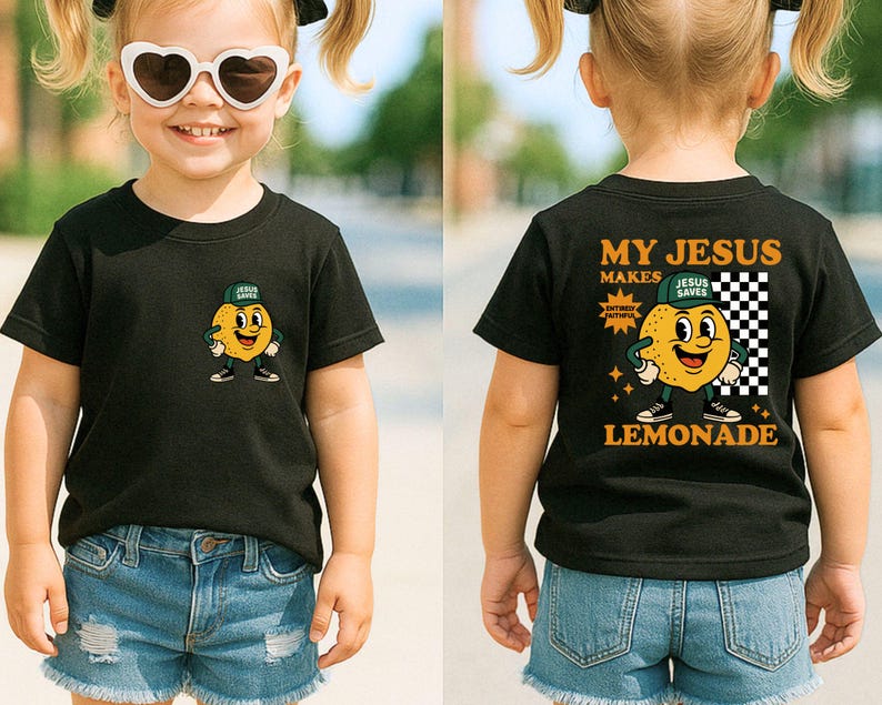 K&ouml;nnte beinhalten: Schwarzes Kurzarm-T-Shirt mit einem Cartoon-Zitronen-Motiv auf der Vorder- und R&uuml;ckseite. Auf der Vorderseite ist eine Zitrone mit Hut abgebildet. Auf der R&uuml;ckseite des Shirts steht "MY JESUS MAKES LEMONADE".