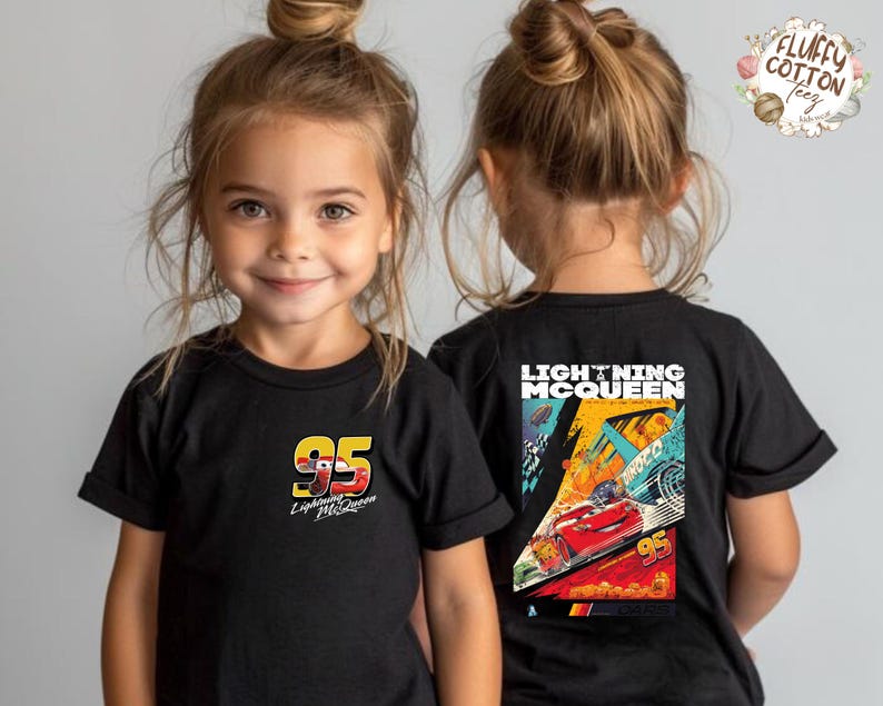 May include: Black Lightning McQueen t-shirts for children. The front displays the number 95 and the Lightning McQueen logo. The back of the shirt has a colourful graphic of Lightning McQueen racing.