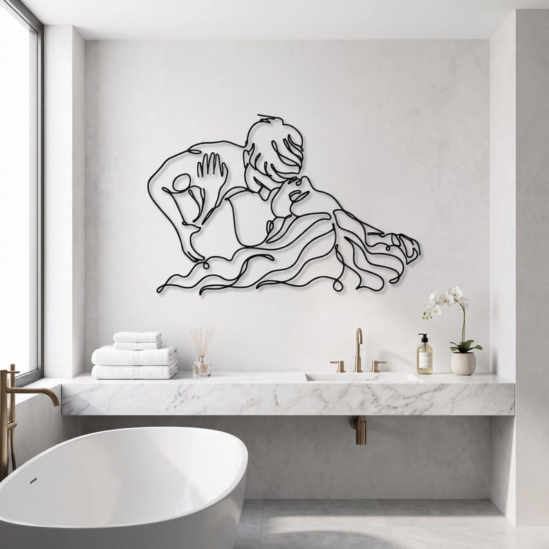 Modern bathroom wall art featuring a romantic continuous line art couple in matte black, positioned elegantly above a sleek white freestanding tub.