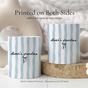 May include: Two white ceramic mugs with a blue striped design. The text "oliver's grandma" is printed on both sides of the mugs. The mugs have a full-wrap striped design and are printed on both sides.