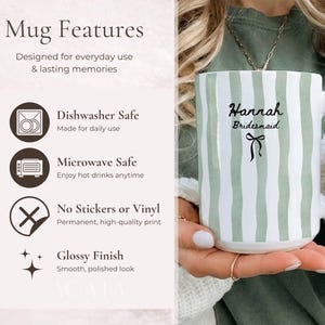May include: White ceramic mug with vertical green stripes. The mug features the name "Hannah" and the word "Bridesmaid" in black script, along with a black bow graphic. The mug is dishwasher and microwave safe.