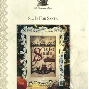 May include: A cross-stitch pattern featuring the letter "S" with the text "is for Santa" in a white frame. The pattern is surrounded by a festive Christmas scene with a candle, a pomegranate, and a candy cane.