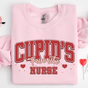 Nurse Cupid Valentine Sweatshirt, Nurse Valentines Day Sweatshirts, Valentine Nurse Shirts, Valentine Nursing Sweater, Nurse Valentine Gift
