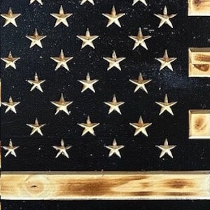 Example of wood burning affect on the exposed pine stripes within the Flag.