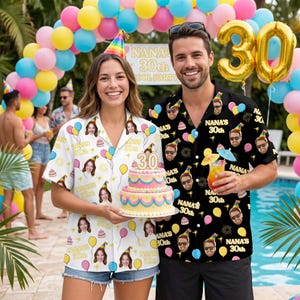 May include: A couple at a 30th birthday pool party, wearing matching Hawaiian shirts with a custom design. The shirts display faces, balloons, and the text "NANA'S 30th". They are holding a multi-layered cake with a "30" topper, in front of a balloon arch.