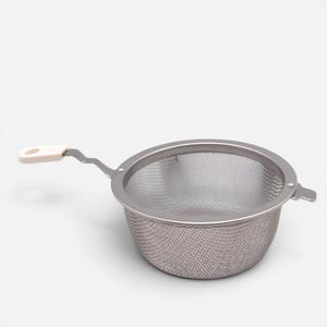 May include: A silver-colored stainless steel mesh strainer with a circular bowl and a fine wire mesh screen. The strainer features a short, angled metal handle tipped with a small, off-white plastic grip that includes a circular hanging hole.