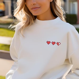 Pixelated Heart Container Sweatshirt, Embroidered Zelda Inspired Design, Video Game Gift, Gaming Apparel, Vintage Gamer Jumper