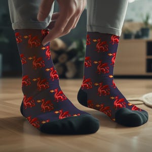 May include: A pair of dark blue socks with a red dragon pattern. The dragons are breathing fire and have gold accents.