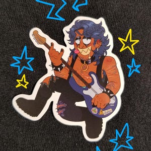 May include: A sticker of a cartoon character playing an electric guitar. The character has blue hair, a beard, and is wearing a black leather jacket with studs. The guitar is blue and has a sticker on it that says "Danger". The sticker is surrounded by yellow and blue stars.