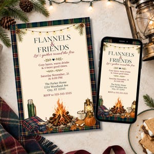 May include: A rectangular invitation card and a smartphone displaying a Flannels & Friends event design. The cream-colored card features a green and red plaid border, string lights, a campfire illustration, and text including the date and address.