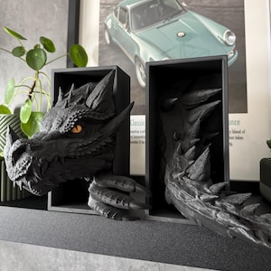 Black Dragon Book Nook with Yellow Eyes on a floating shelf