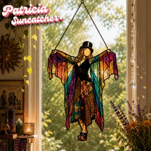 May include: A stained glass suncatcher depicting a woman with outstretched wings, wearing a black top hat and a colourful dress. The wings are a vibrant mix of rainbow colours. The text "Patricia Suncatcher" is at the top.