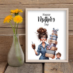 May include: A white framed print with the text "Happy Mother's Day" at the top. The print features a cartoon illustration of a woman with brown hair holding a stack of wrapped gifts and a cup of coffee. A small boy stands next to her.