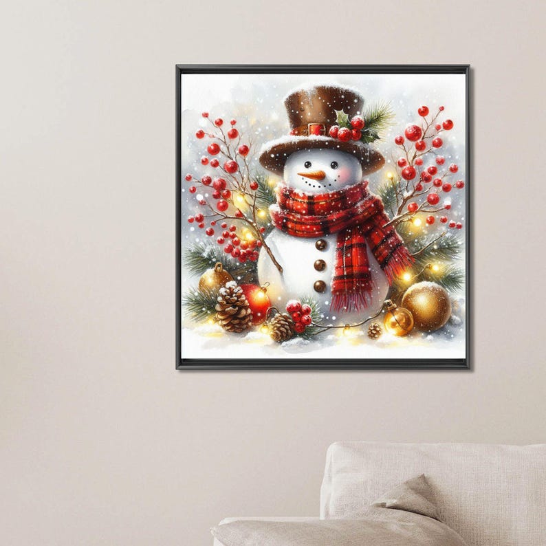 May include: A framed winter-themed artwork featuring a snowman wearing a brown top hat and a red plaid scarf. The snowman is surrounded by red berries, pine needles, and golden ornaments, with a snowy background.