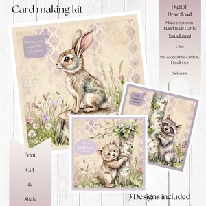 May include: A card making kit with three designs. The main card features a watercolor illustration of a rabbit on a tree stump. Other cards include a bear and a raccoon. The kit includes instructions and materials for making handmade cards.