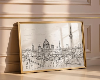 May include: A framed black and white sketch of a cityscape, featuring prominent buildings and a tall tower. The artwork is in a gold frame, leaning against a wall. The style is reminiscent of architectural drawings.