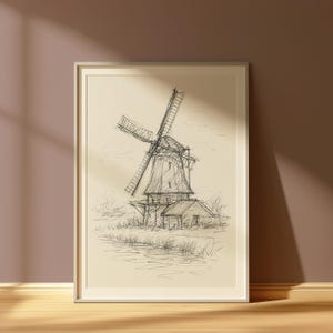 Può includere: Schizzo incorniciato di un mulino a vento con un disegno dettagliato delle pale, del corpo e del paesaggio circostante. L'opera d'arte in bianco e nero è ambientata su uno sfondo color crema e incorniciata in una cornice di legno chiaro.