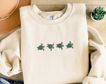 Embroidered turtle sweater in a cozy unisex fit with a simple turtle stitching