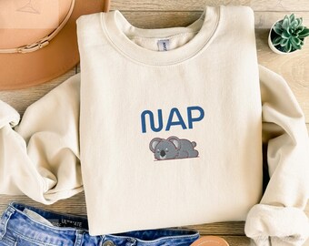 Embroidered koala sweatshirt with nap lettering in a cozy unisex fit