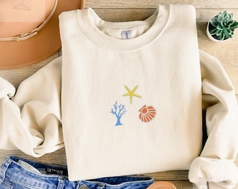 Embroidered sea life trio sweatshirt in a cozy unisex fit with a cute simple design