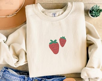 Embroidered strawberry sweatshirt in a cozy unisex fit with a cute simple design
