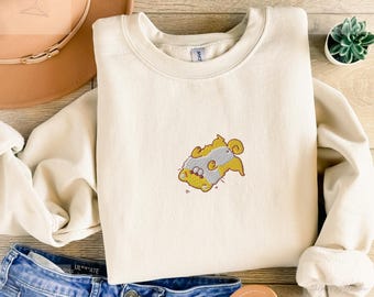 Embroidered playful puppy sweatshirt in relaxed unisex fit