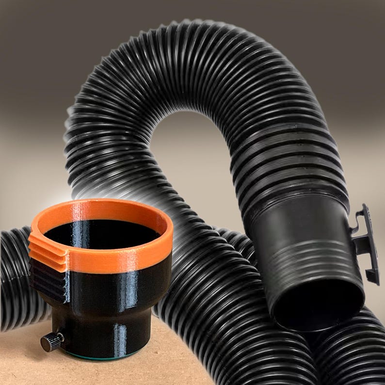 May include: Black corrugated flexible hose with an orange and black container. The container has a knob and a ribbed orange rim. The hose is curved and has a large opening. The background is a gradient of brown and gray.
