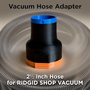 May include: A black, orange, and blue vacuum hose adapter. The adapter is designed for a 2.5-inch hose and is labeled for a RIDGID shop vacuum. The text "Vacuum Hose Adapter" is at the top of the image.